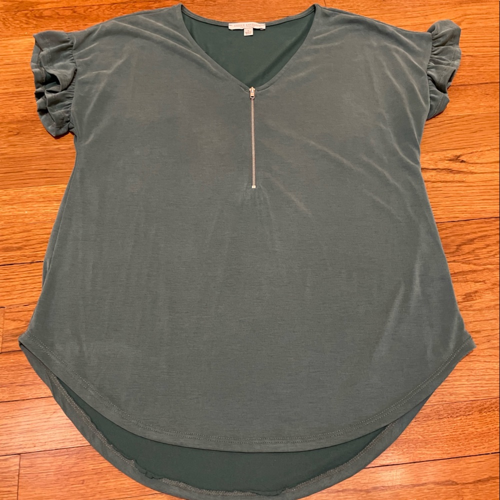 Ladies size Large top with cute short sleeves with ruffles. Never worn.